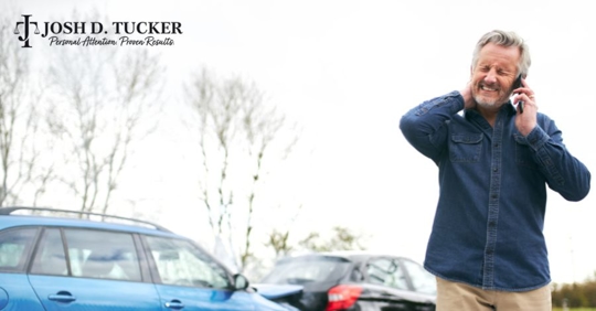 man beside a car crash